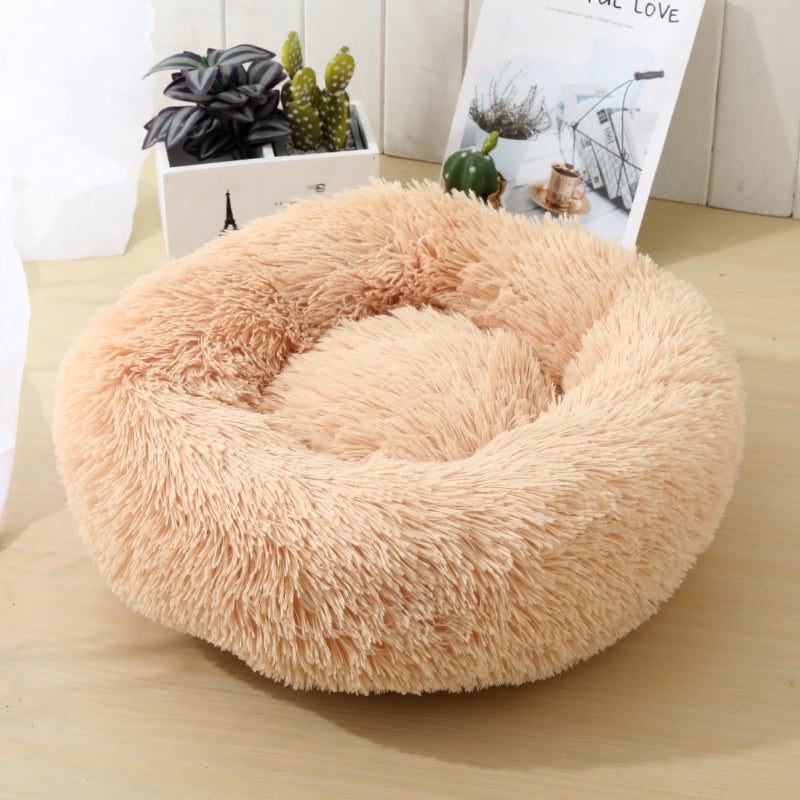 Soft Calming Donut Bed for Dogs and Cats, featuring a plush, fluffy design with raised edges for comfort and security.
