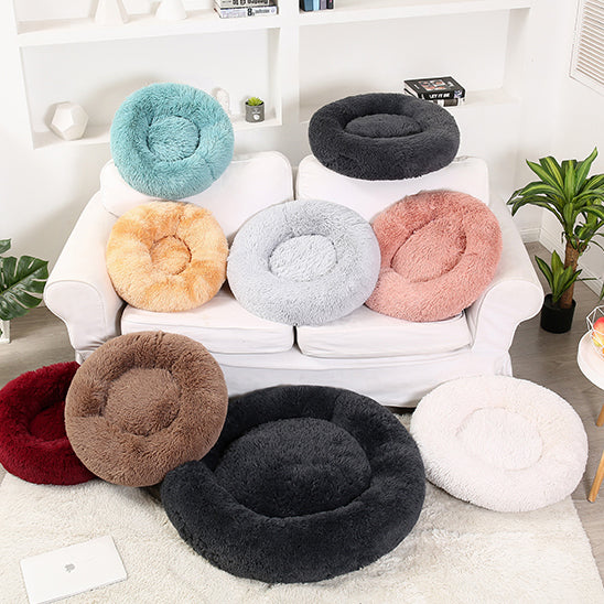 Soft Calming Donut Bed for Dogs and Cats, featuring a plush, fluffy design with raised edges for comfort and security.
