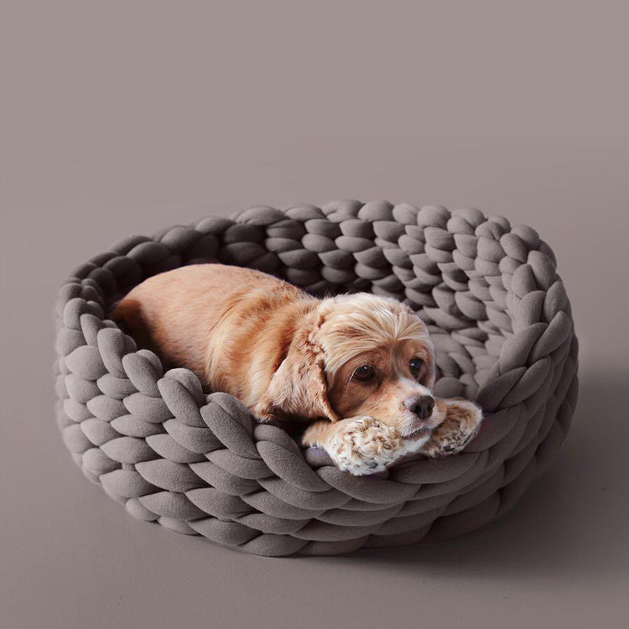 A cozy, handmade knit pet bed designed for small dogs and cats, featuring a soft, breathable fabric and a detachable design for easy washing.
