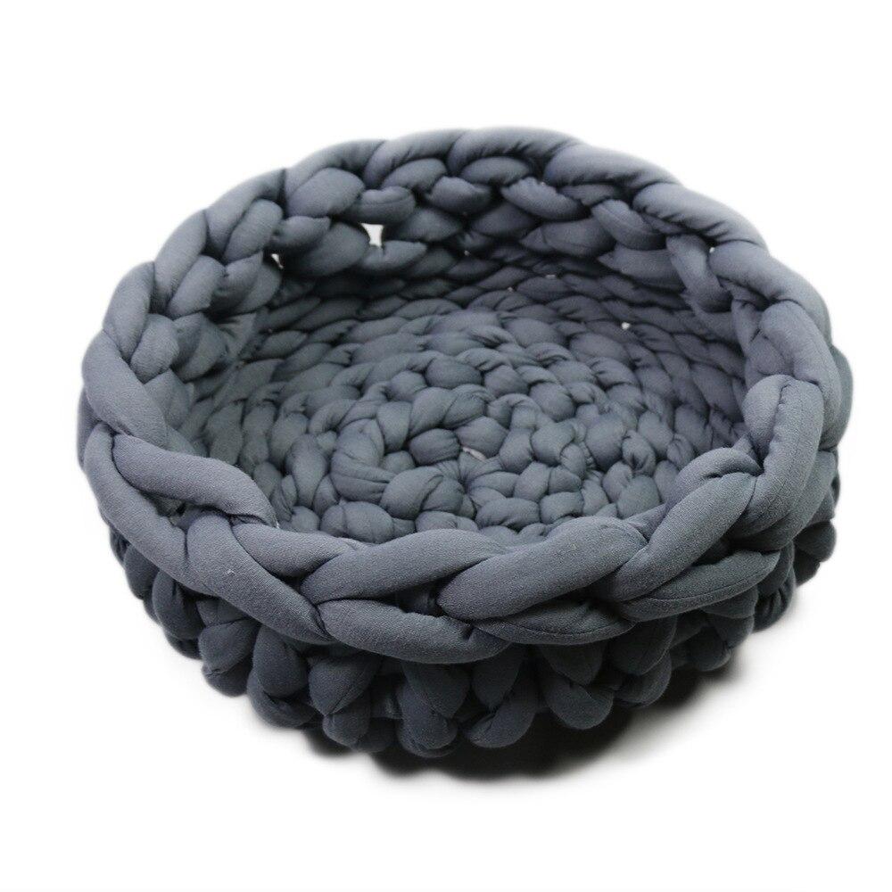 A cozy, handmade knit pet bed designed for small dogs and cats, featuring a soft, breathable fabric and a detachable design for easy washing.