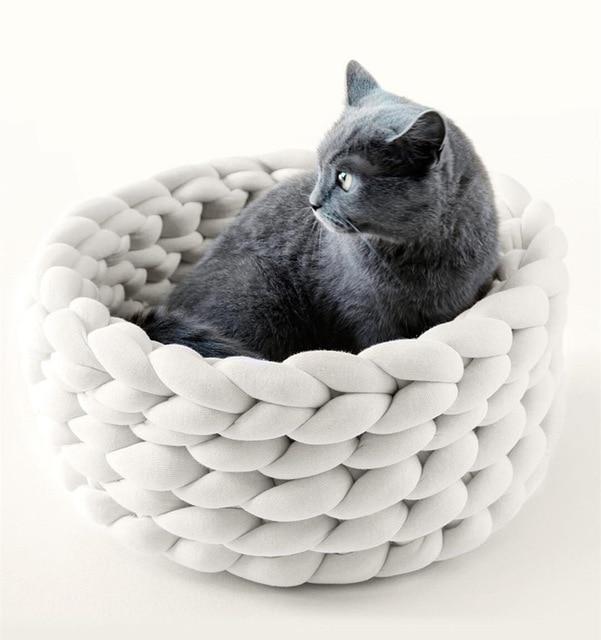 A cozy, handmade knit pet bed designed for small dogs and cats, featuring a soft, breathable fabric and a detachable design for easy washing.