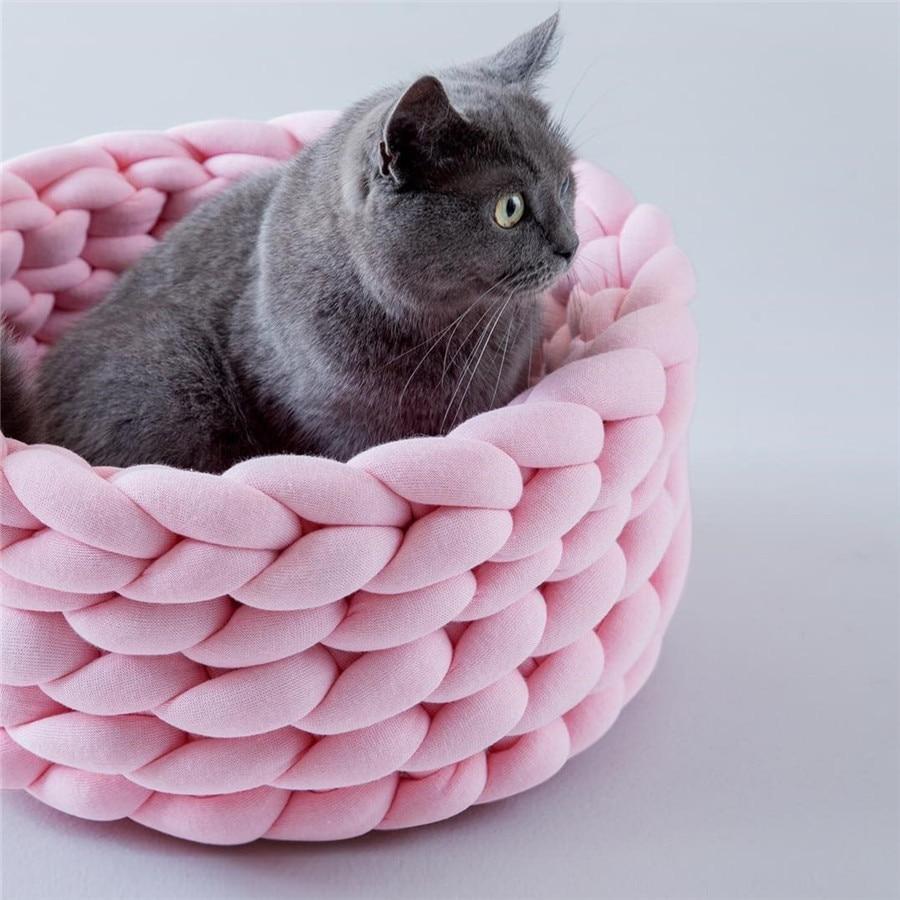 A cozy, handmade knit pet bed designed for small dogs and cats, featuring a soft, breathable fabric and a detachable design for easy washing.