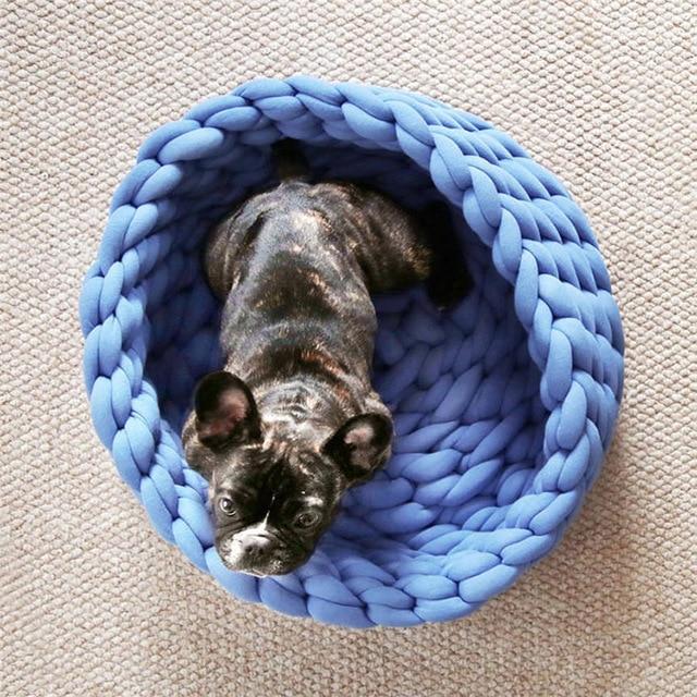 A cozy, handmade knit pet bed designed for small dogs and cats, featuring a soft, breathable fabric and a detachable design for easy washing.