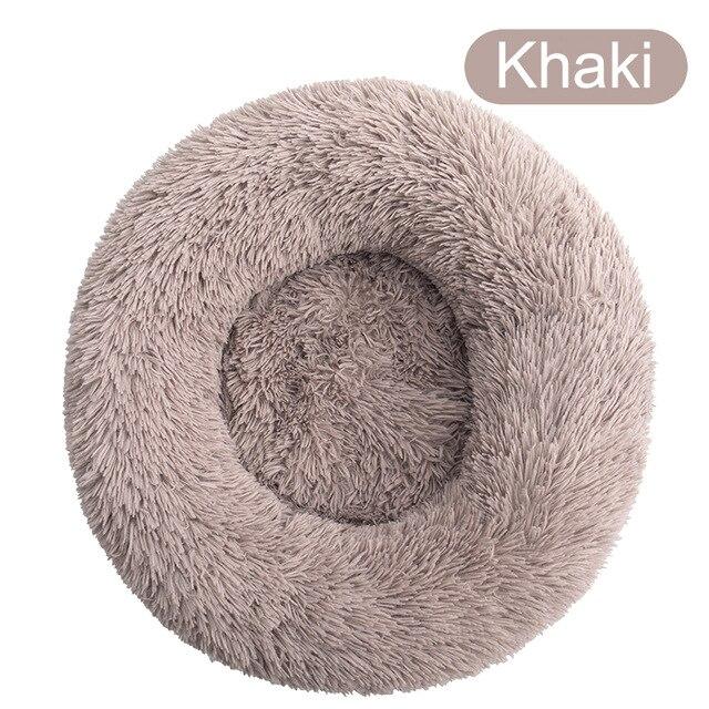 A soft, round dog bed made of plush coral fleece, designed for winter comfort, suitable for small and large dogs and cats.
