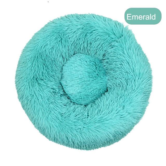 A soft, round dog bed made of plush coral fleece, designed for winter comfort, suitable for small and large dogs and cats.