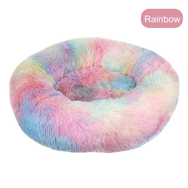 A soft, round dog bed made of plush coral fleece, designed for winter comfort, suitable for small and large dogs and cats.