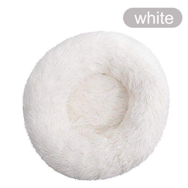 A soft, round dog bed made of plush coral fleece, designed for winter comfort, suitable for small and large dogs and cats.