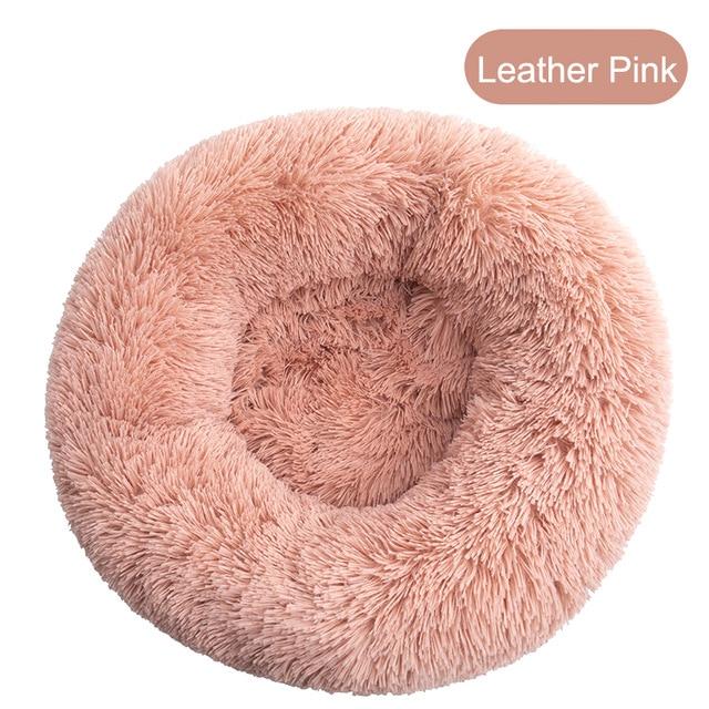 A soft, round dog bed made of plush coral fleece, designed for winter comfort, suitable for small and large dogs and cats.