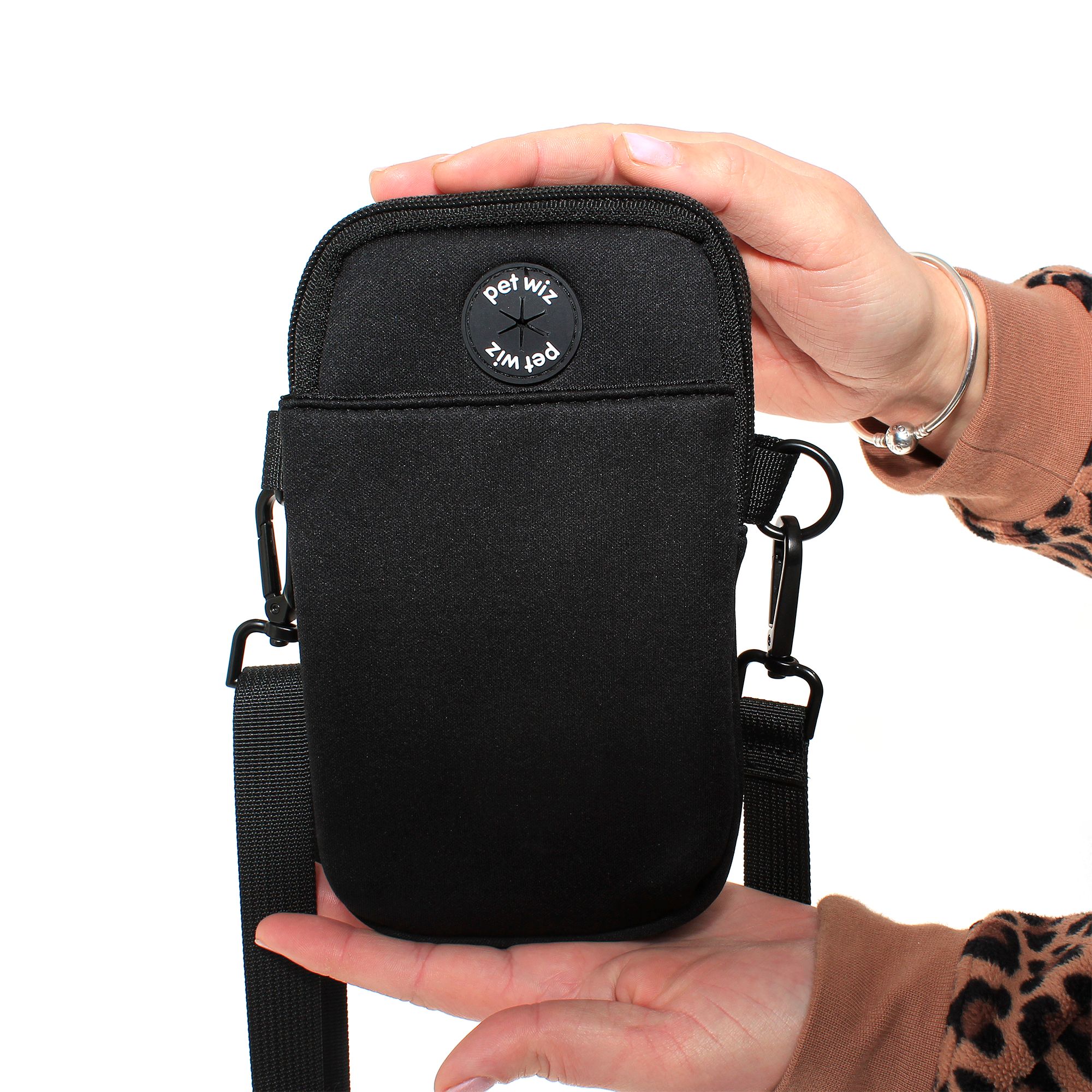 A stylish and functional lightweight dog walking bag with zipped compartments and adjustable strap, perfect for dog owners.
