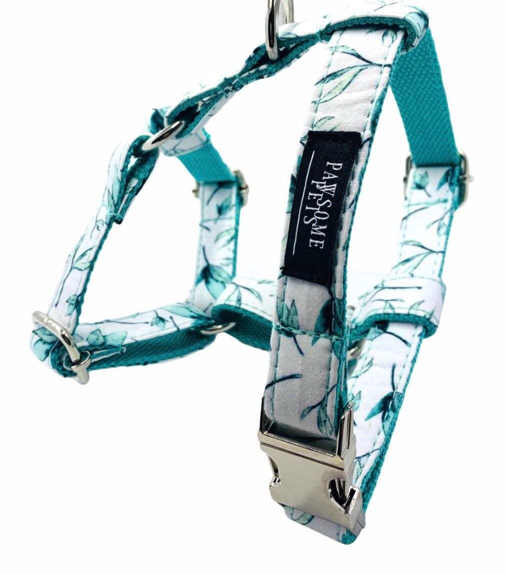 Two pieces of mint leaf patterned pet harnesses, showcasing durable construction and stylish design.