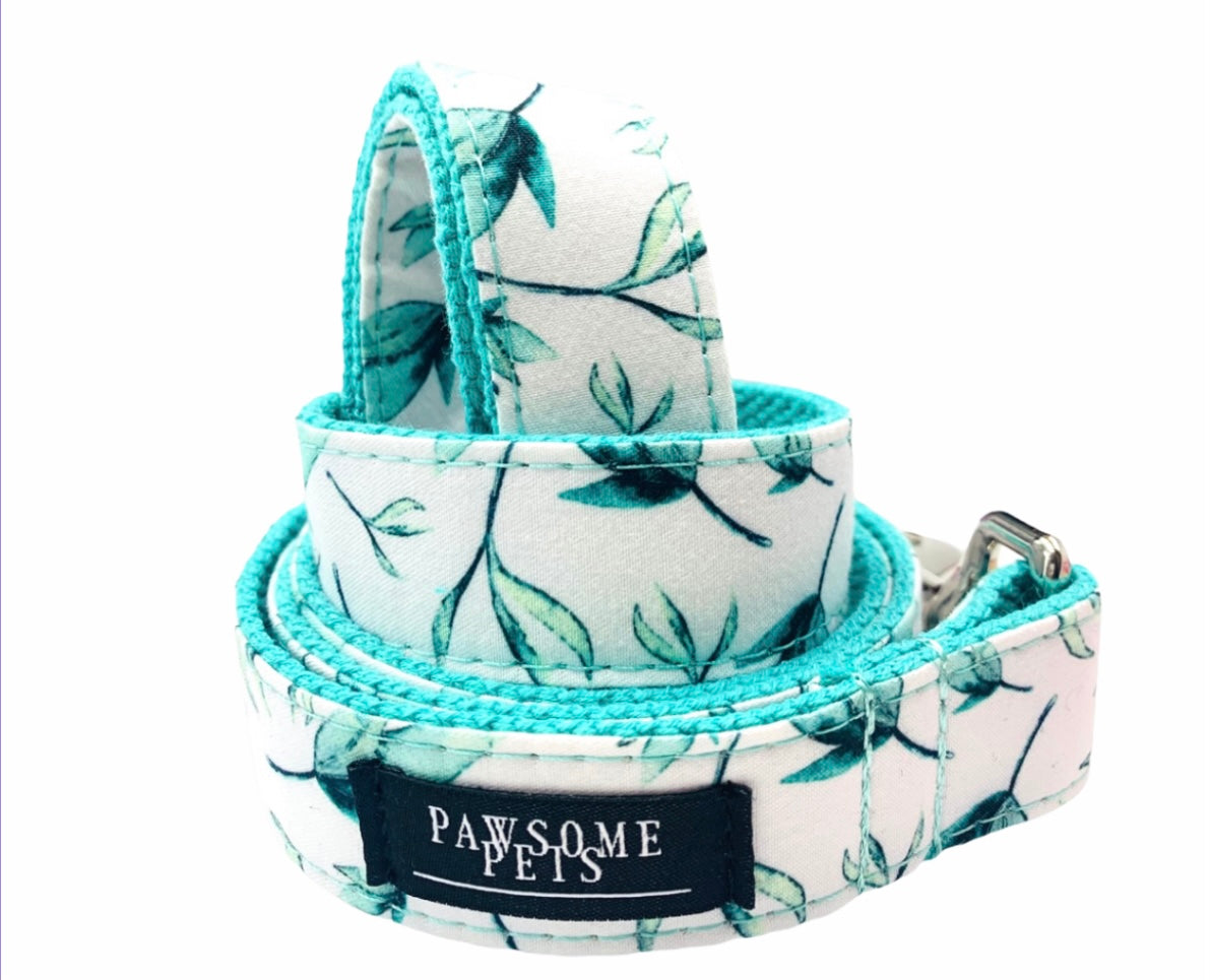 Two pieces of mint leaf patterned pet harnesses, showcasing durable construction and stylish design.