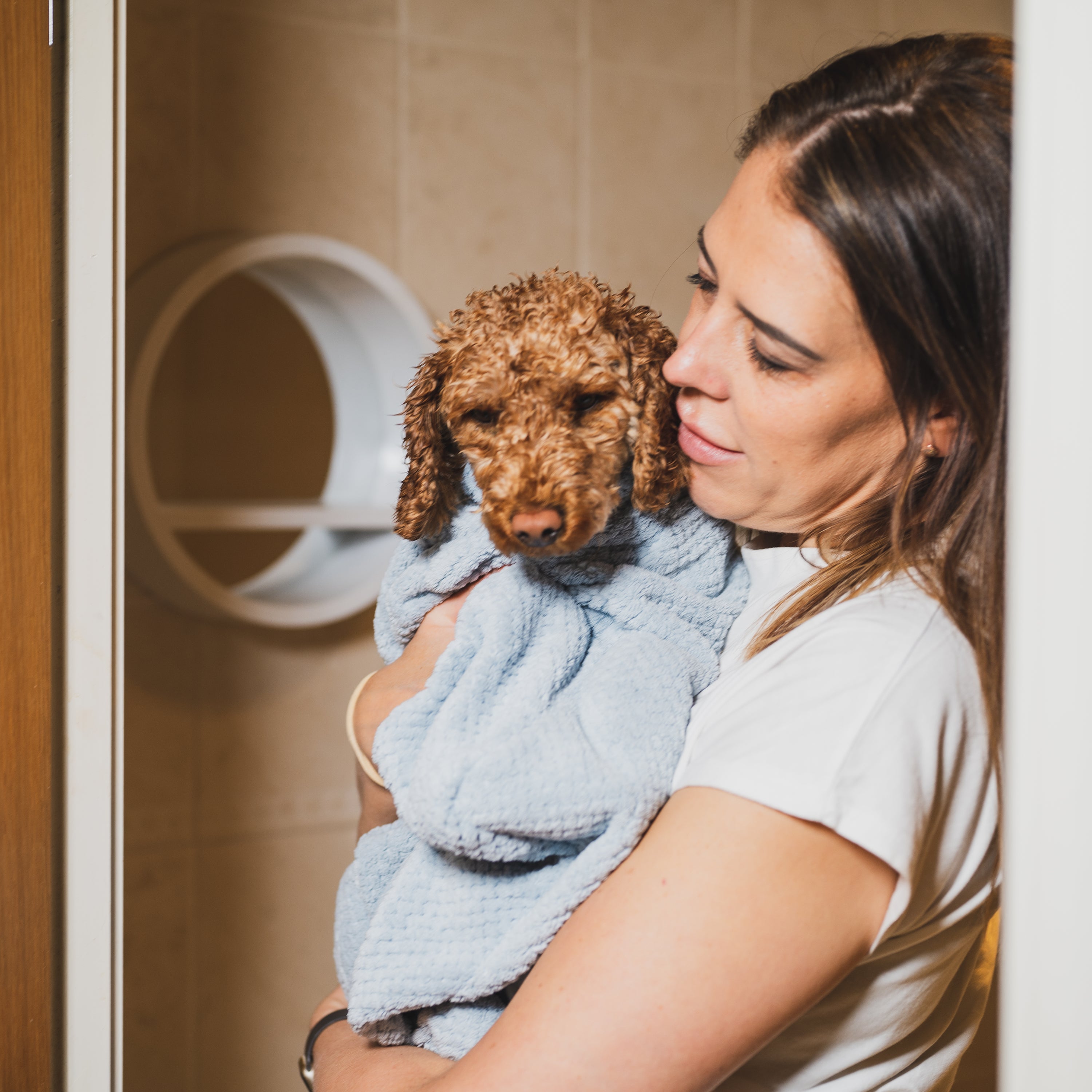 Super Absorbent Microfibre Dog Drying Bag in sky blue, designed to keep pets dry and comfortable after outdoor activities.