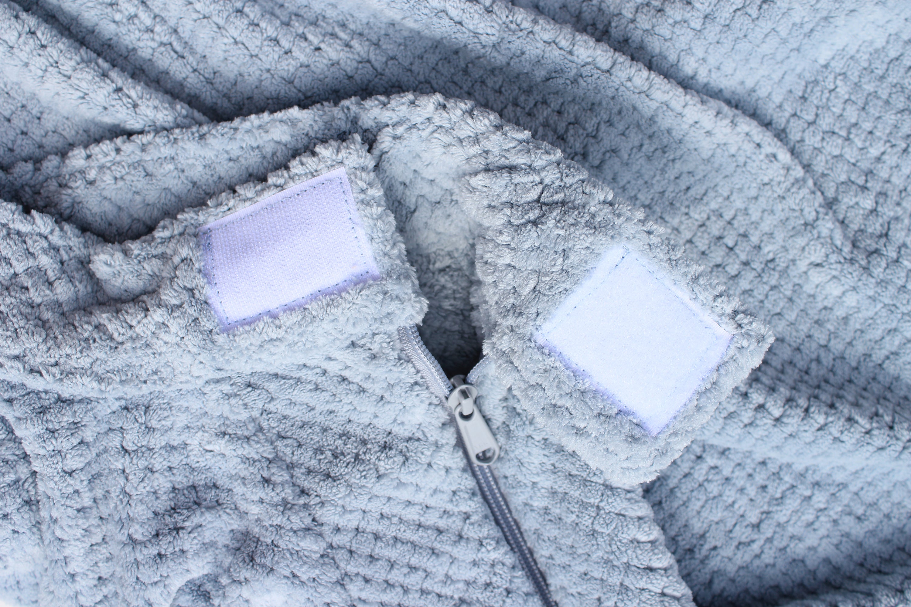 Super Absorbent Microfibre Dog Drying Bag in sky blue, designed to keep pets dry and comfortable after outdoor activities.