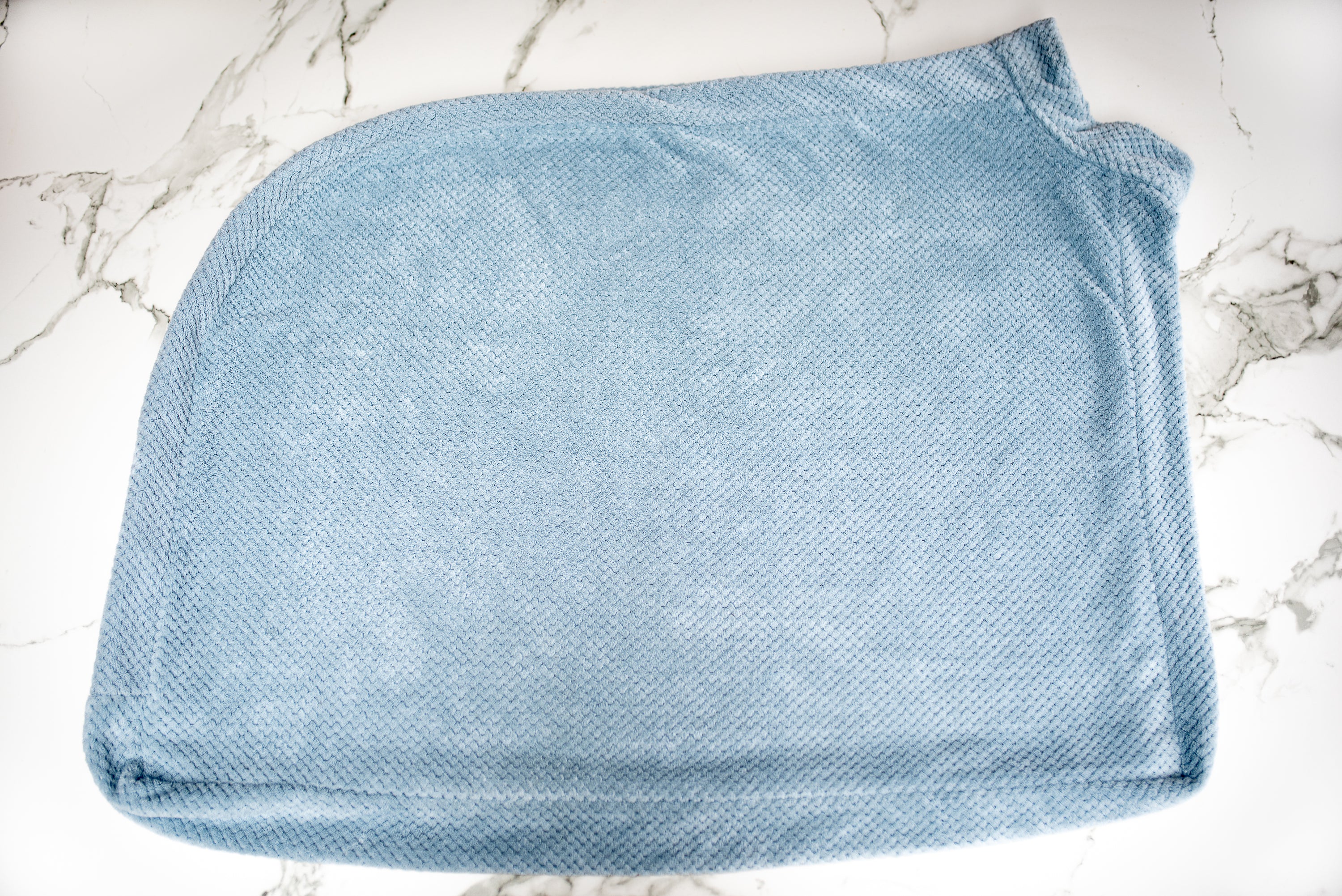 Super Absorbent Microfibre Dog Drying Bag in sky blue, designed to keep pets dry and comfortable after outdoor activities.