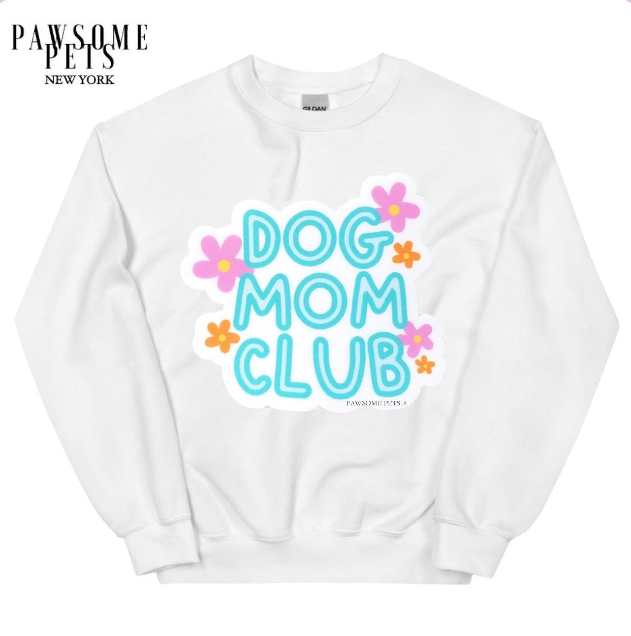 A cozy unisex sweatshirt featuring the text 'Dog Mom Club' printed in eco-friendly ink, perfect for dog lovers.