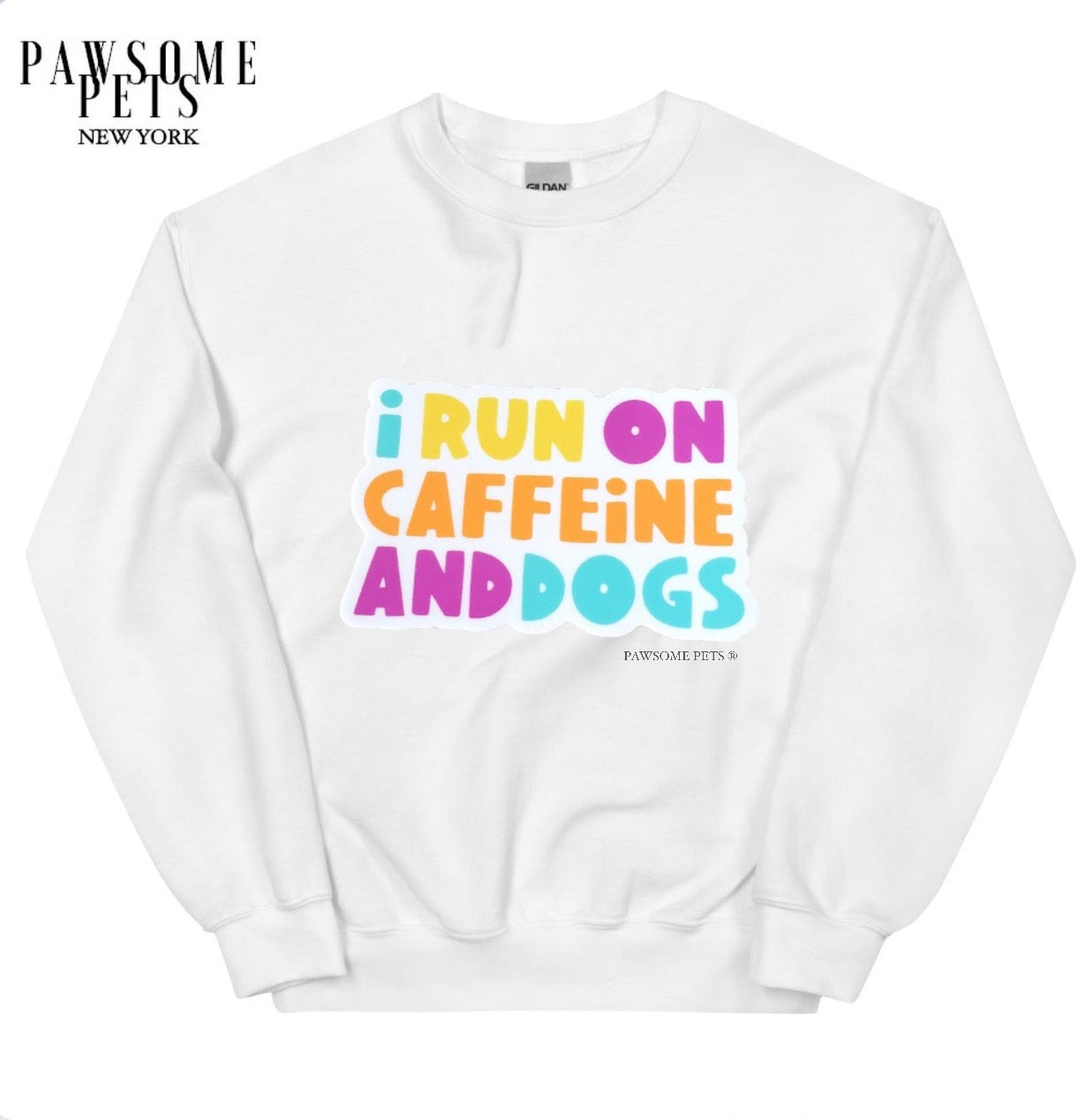 A cozy unisex sweatshirt featuring the phrase 'I RUN ON CAFFEINE AND DOGS' printed in eco-friendly ink, perfect for dog lovers.