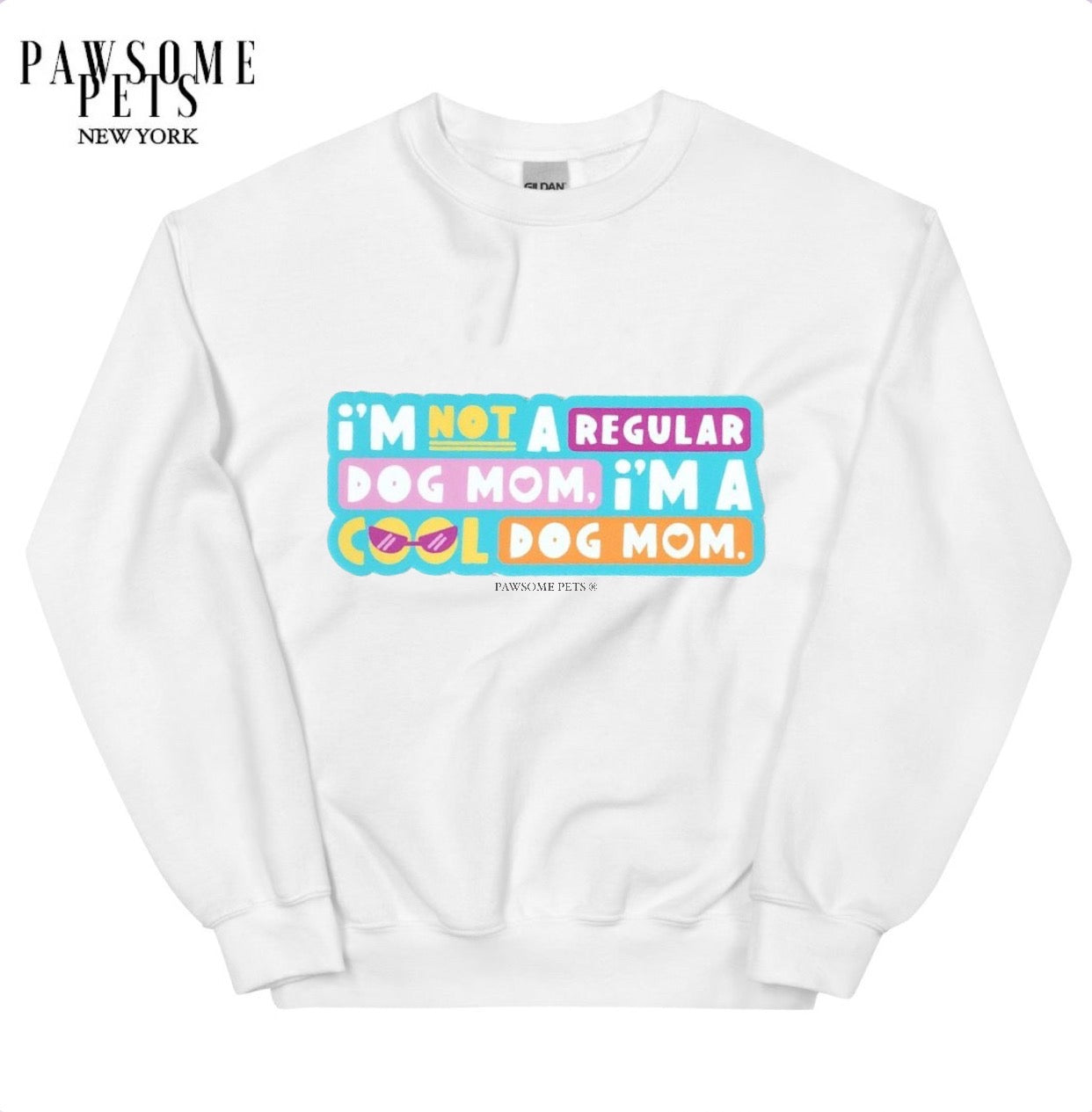 A stylish unisex sweatshirt featuring the phrase 'I'm Not a Regular Dog Mom, I'm a Cool Dog Mom' printed in eco-friendly ink.