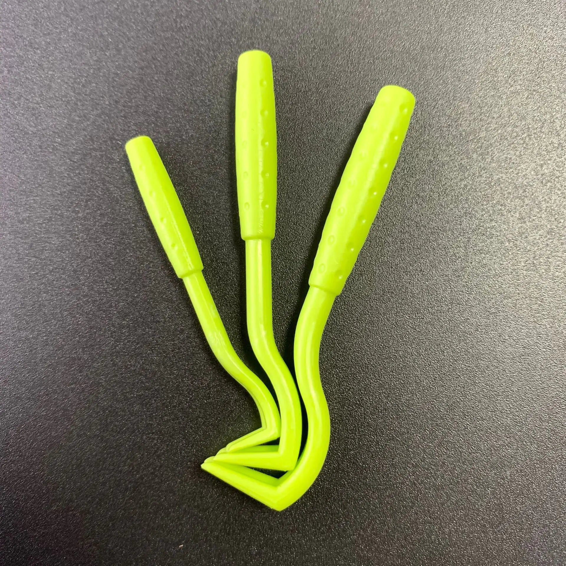 A Tick Removal Tool designed for safe and efficient tick extraction from pets, featuring a durable plastic body and a unique twist hook design.