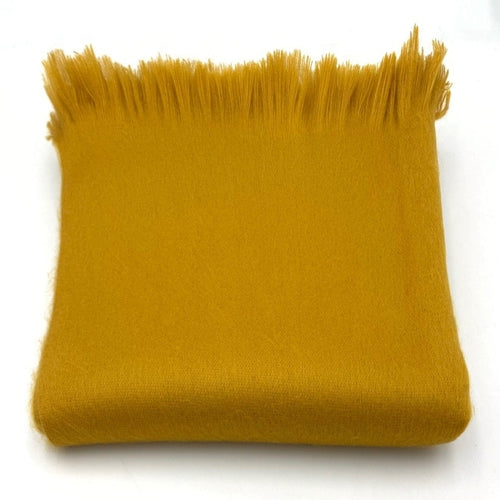 A luxurious Timeless Accent Alpaca Shawl in rich colors, showcasing its soft texture and elegant design.