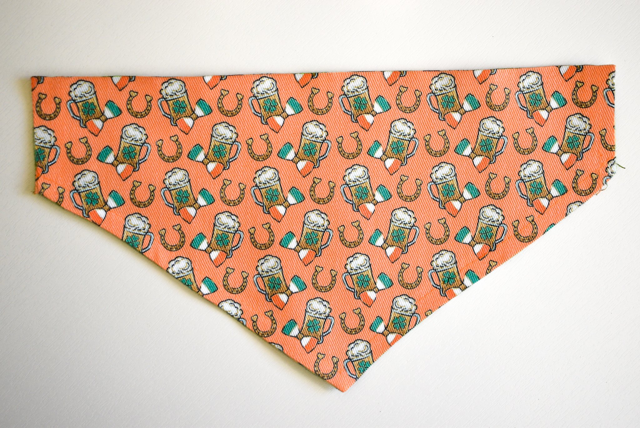 A stylish reversible bandana for dogs, featuring festive St. Patrick's Day designs, made from durable canvas fabric.