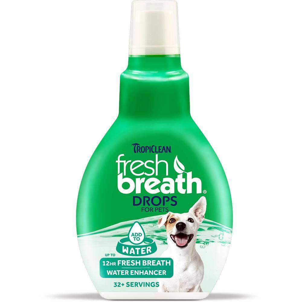 Tropiclean Fresh Breath Drops for Pets in a bottle with a label showcasing natural ingredients for oral care.