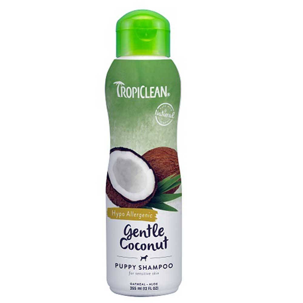 A bottle of Tropiclean Gentle Coconut Pet Shampoo for puppies and kittens, featuring a coconut design and a 12 oz size.
