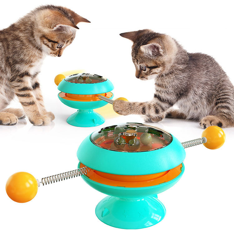 Turntable Cat Toy featuring a teasing stick and catnip ball, designed for interactive play and engagement for cats.
