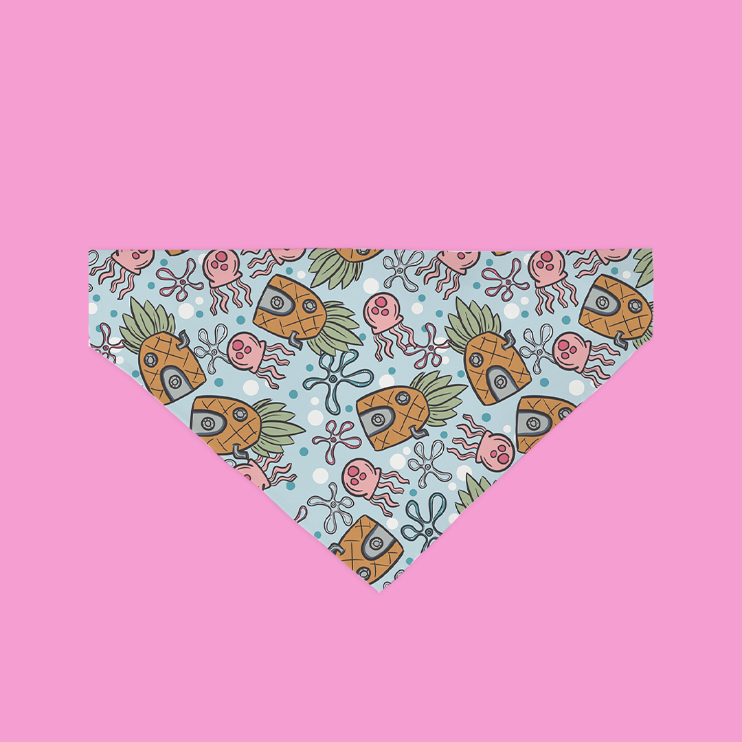 A colorful Under Da Sea Bandana for dogs, featuring vibrant underwater patterns, made from ultra-soft polyester fabric.