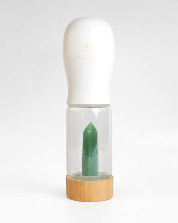 Urban Oasis crystal-infused water bottle with natural crystals, eco-friendly design, perfect for hydration on-the-go.