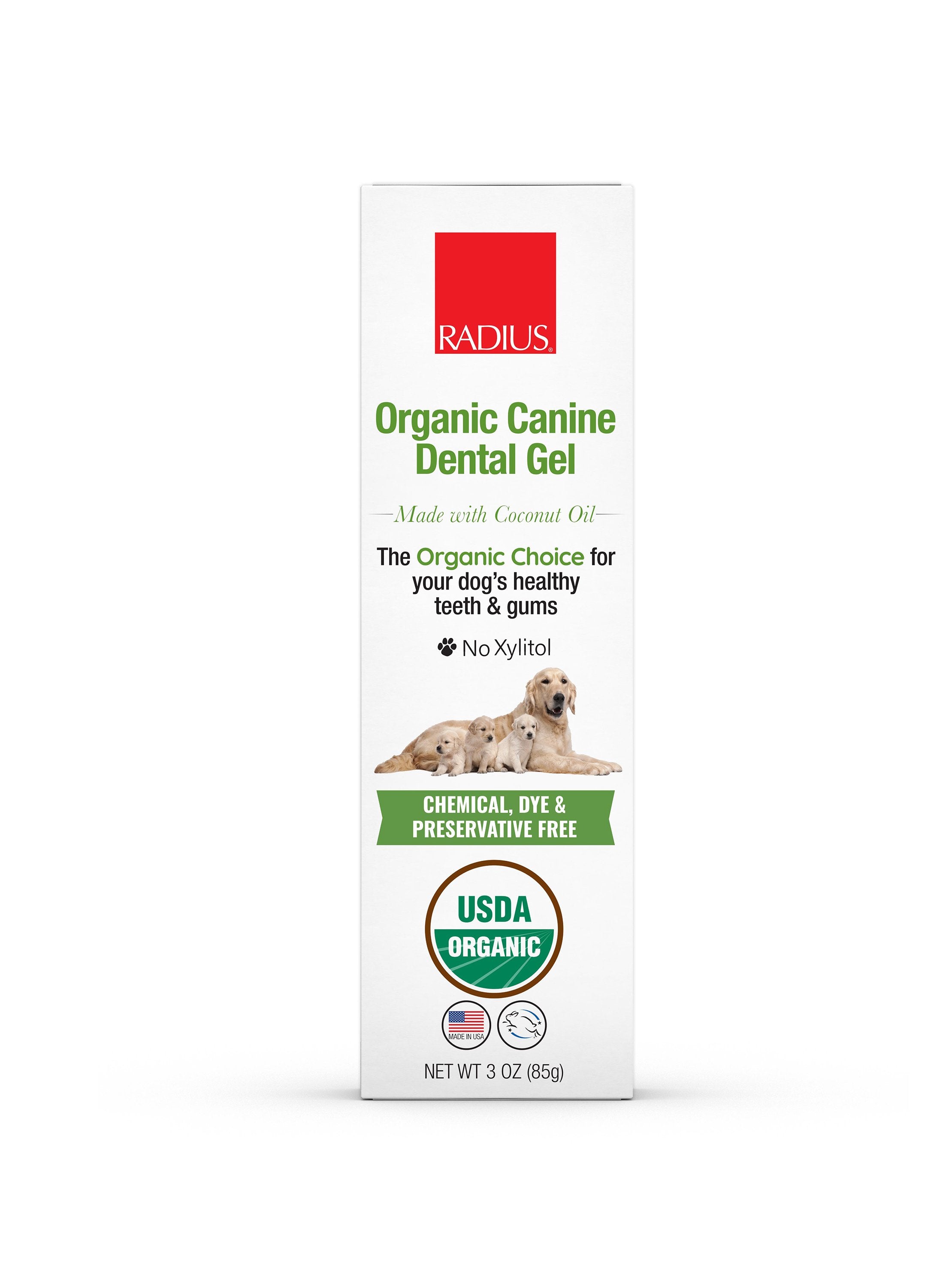 USDA Organic Canine Toothpaste in a tube with sweet potato and mint ingredients displayed around it.