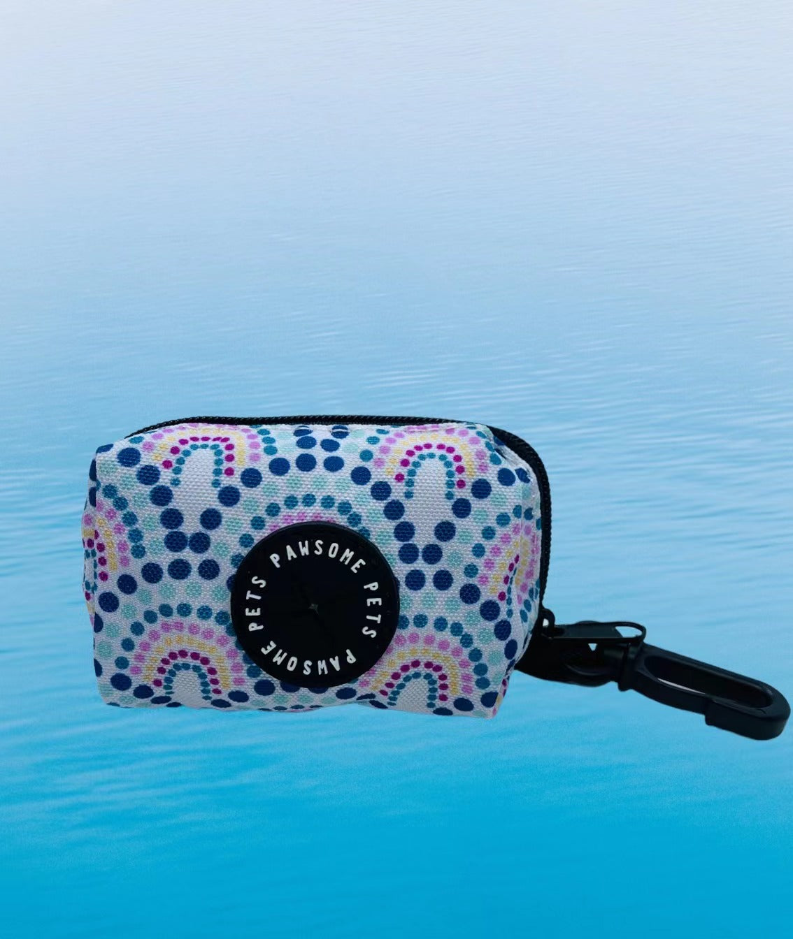 Colorful Rainbow Waste Bag Holder made of durable neoprene, featuring a clip and zipper pull for easy access.