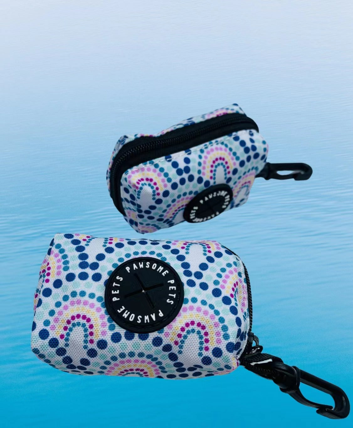 Colorful Rainbow Waste Bag Holder made of durable neoprene, featuring a clip and zipper pull for easy access.