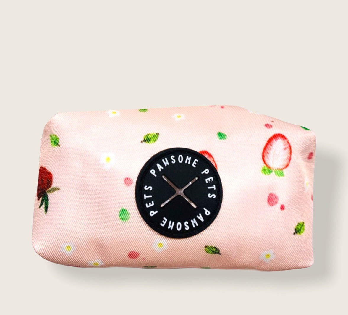 Stylish strawberry-themed waste bag holder made of heavyweight neoprene, featuring a black clasp and compact design.