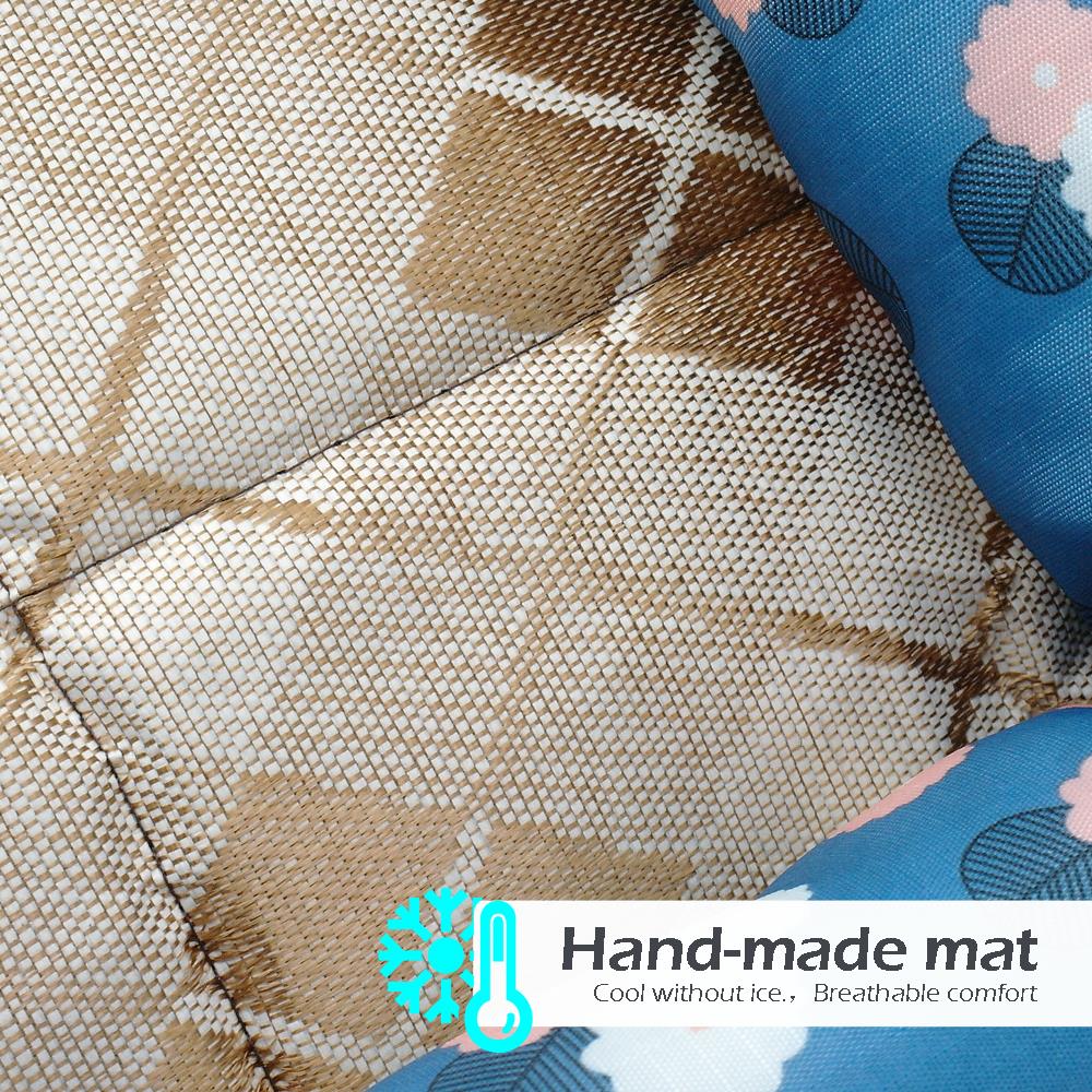 Woven mat with blue pillows.