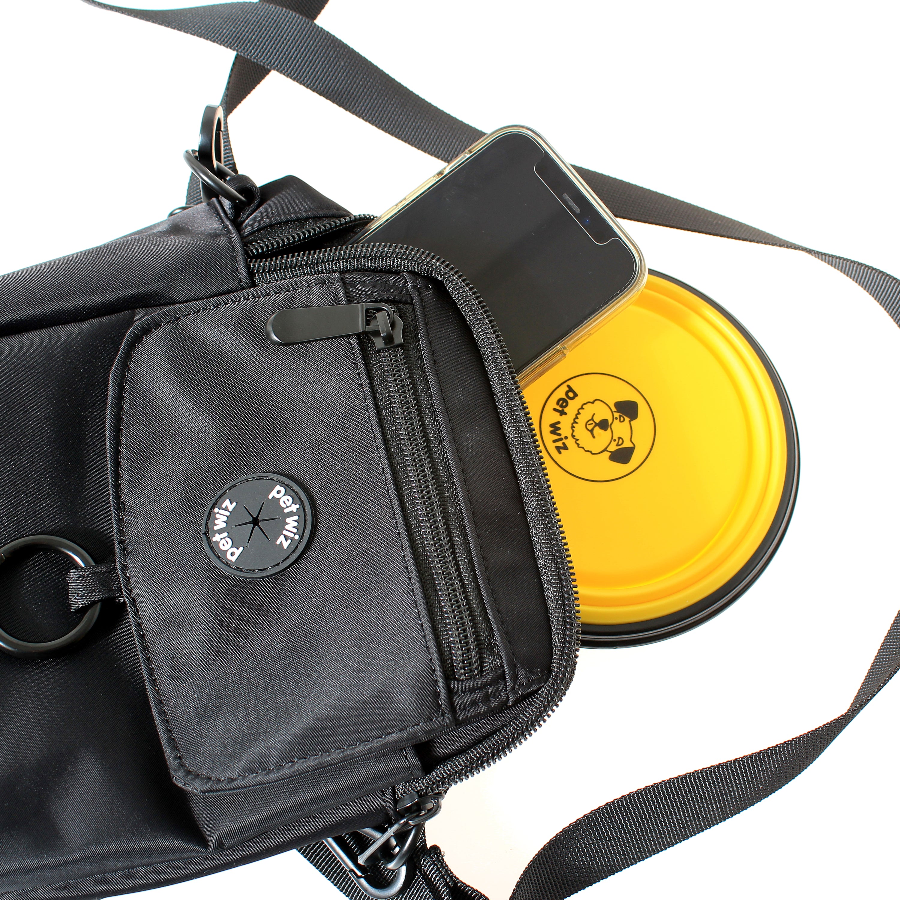 A stylish waterproof dog walking bag with multiple compartments, designed for pet owners to keep essentials organized during walks.