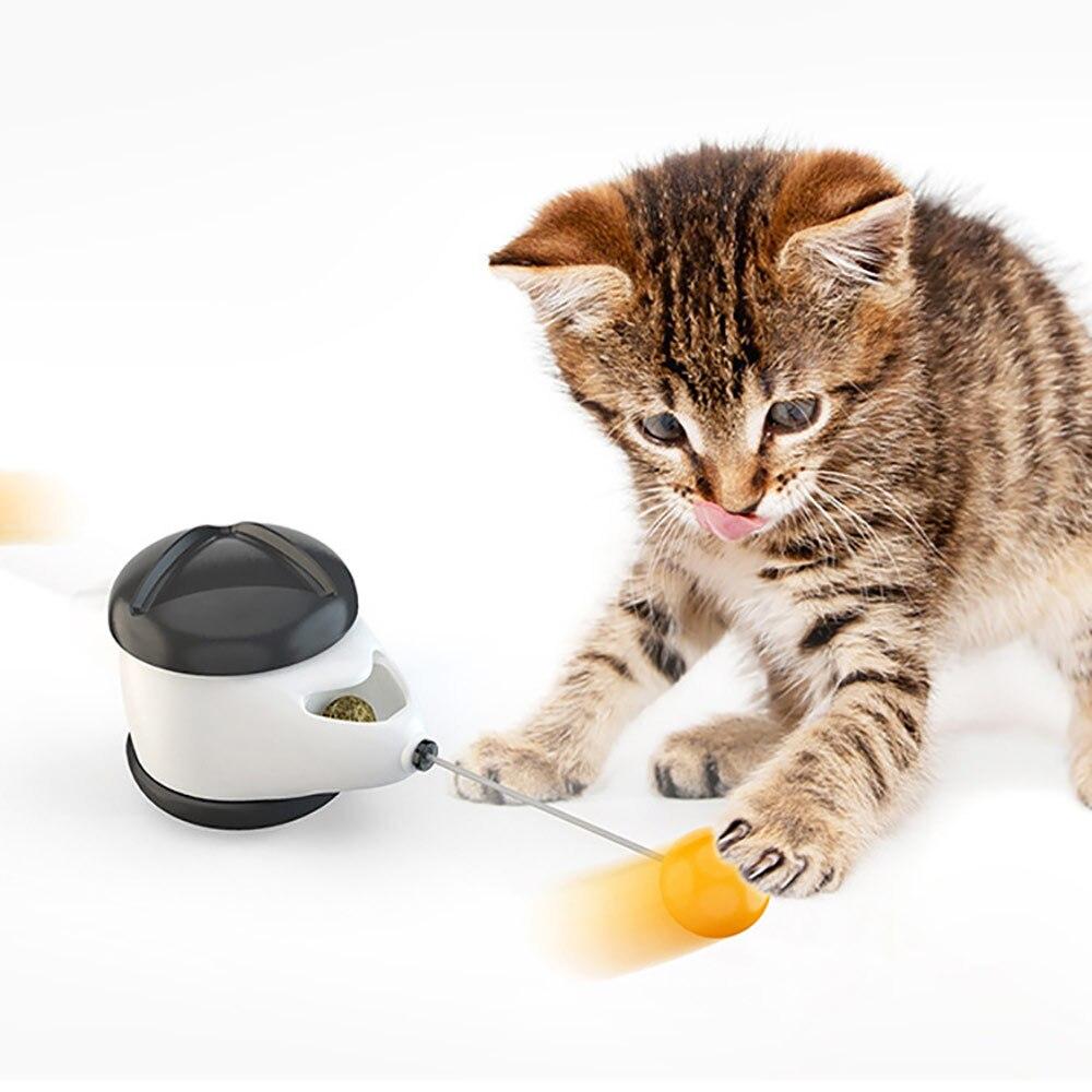 A cute black and white wheel self-balance pet toy designed for interactive play with cats, featuring a mint ball for attraction.
