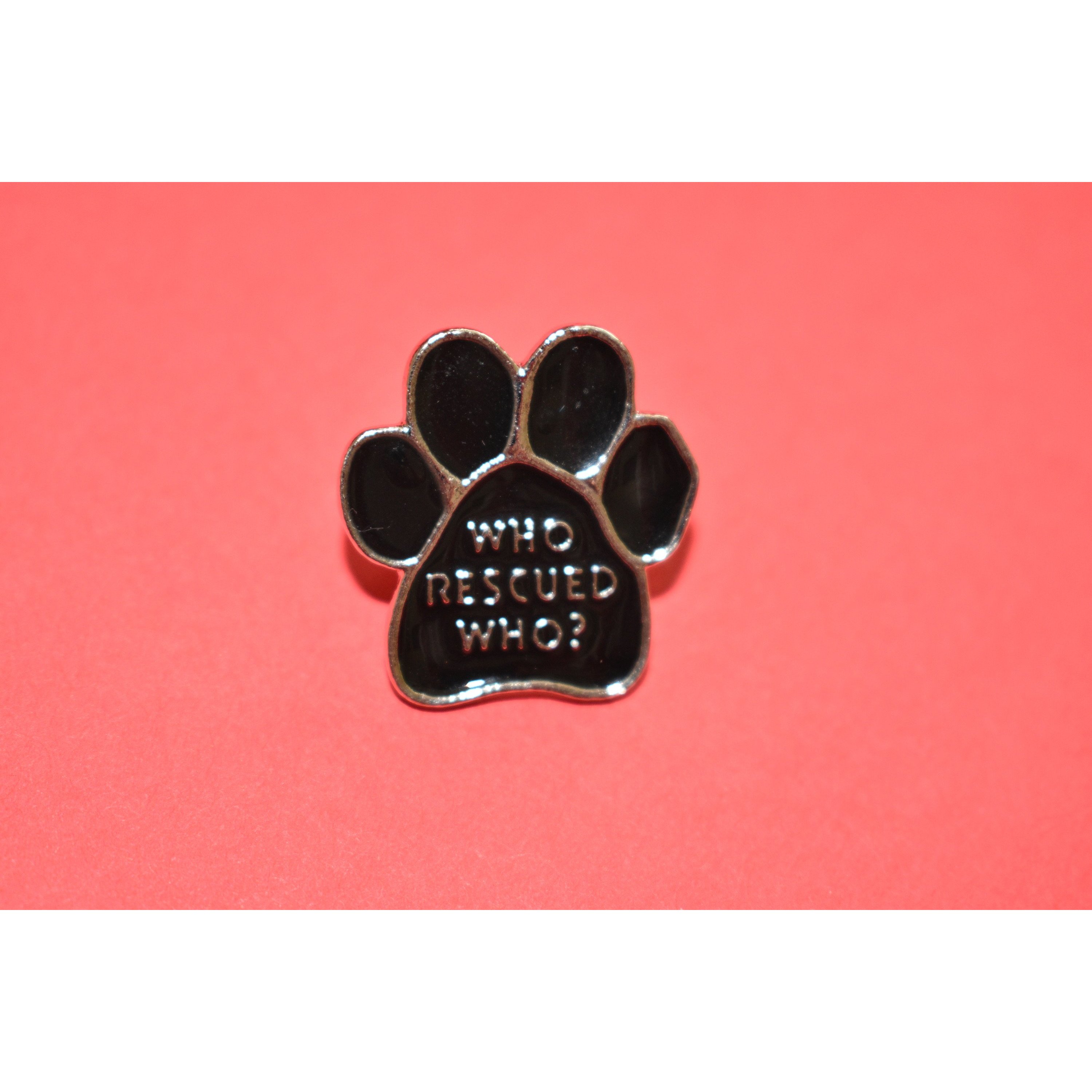 Who Rescued Who Enamel Pin featuring a cute design, perfect for dog lovers and rescue advocates.