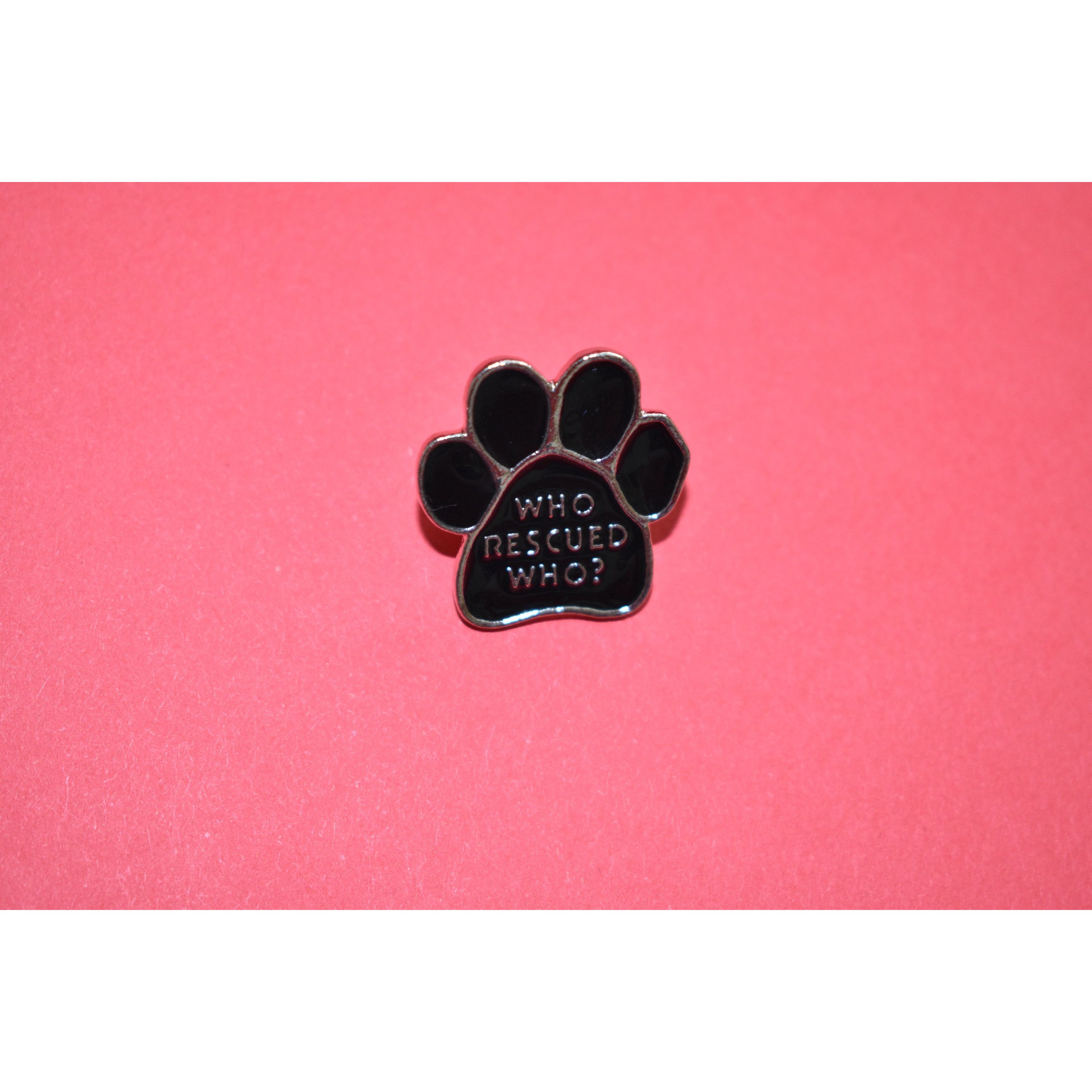 Who Rescued Who Enamel Pin featuring a cute design, perfect for dog lovers and rescue advocates.