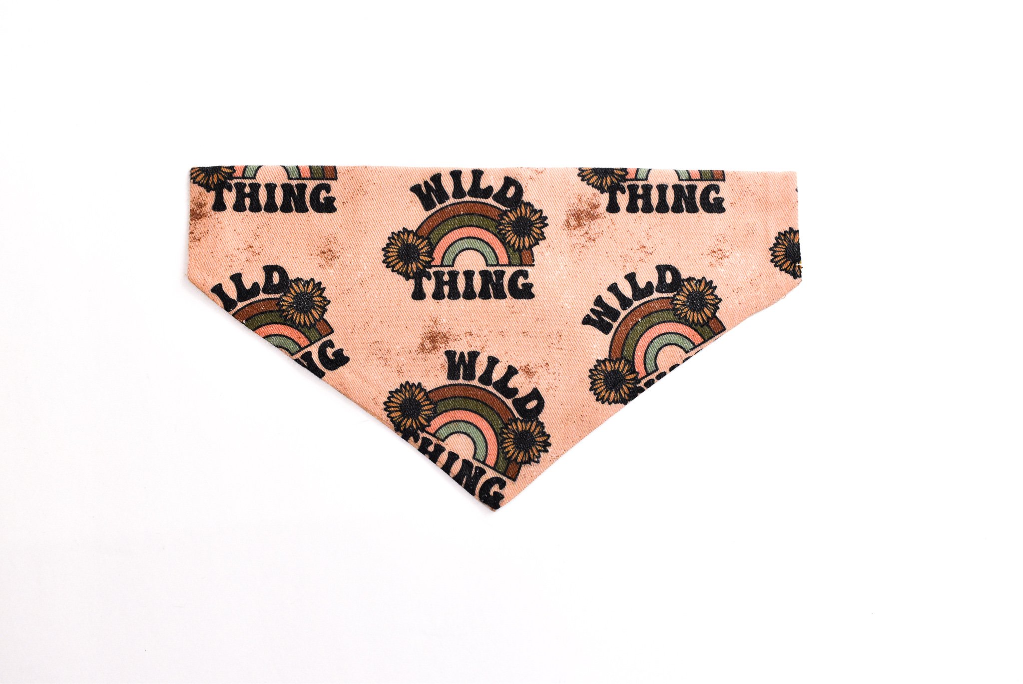 A colorful Wild Thing Bandana for dogs, made from durable canvas fabric, showcasing unique patterns and a slip-on design for easy wear.