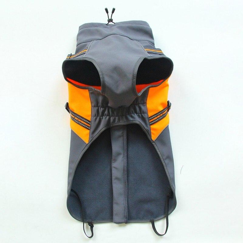 A small dog wearing a waterproof winter vest jacket, showcasing its stylish solid design and warm cotton material, perfect for cold weather.