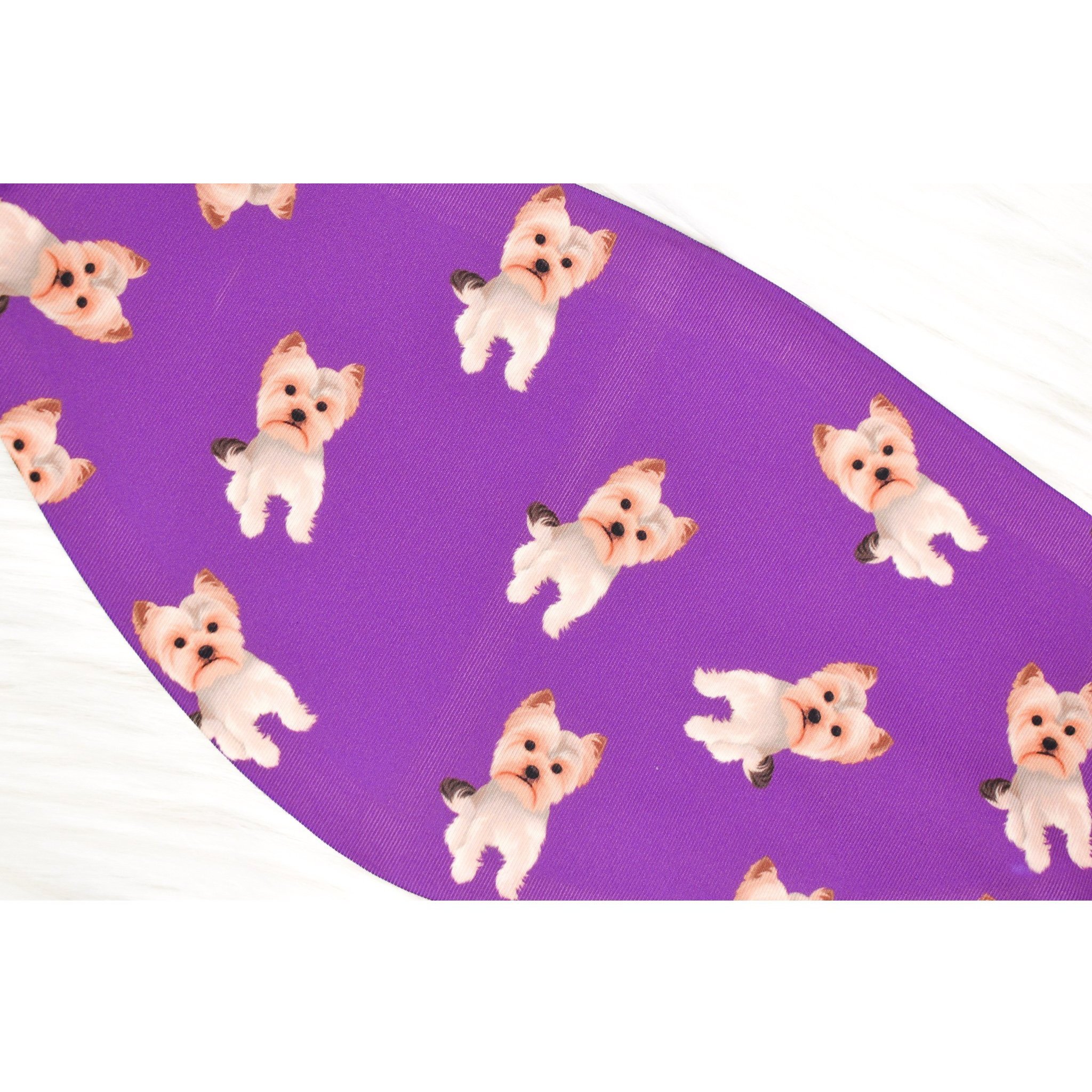 A handmade Yorkie face cover featuring a soft organic cotton interior and durable polyester exterior, available in various sizes.