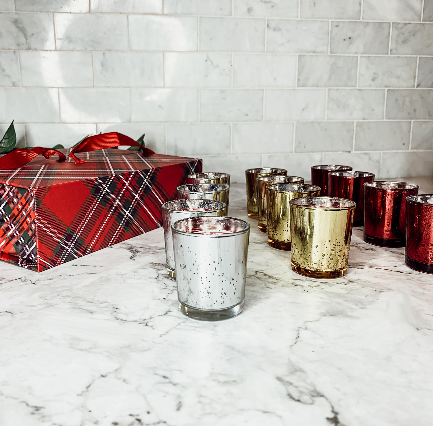 Advent Candle Set featuring 12 scented candles in a festive gift box with Silver, Gold, and Red colors.