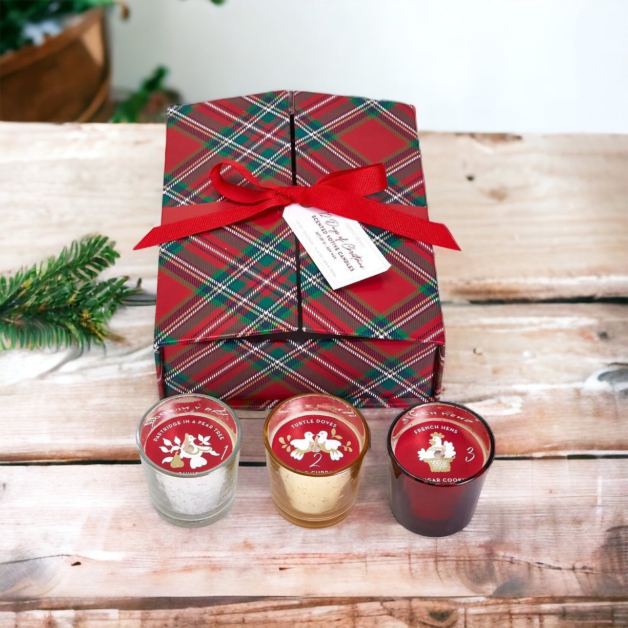 Advent Candle Set featuring 12 scented candles in a festive gift box with Silver, Gold, and Red colors.