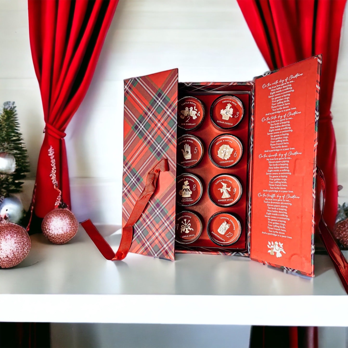 Advent Candle Set featuring 12 scented candles in a festive gift box with Silver, Gold, and Red colors.