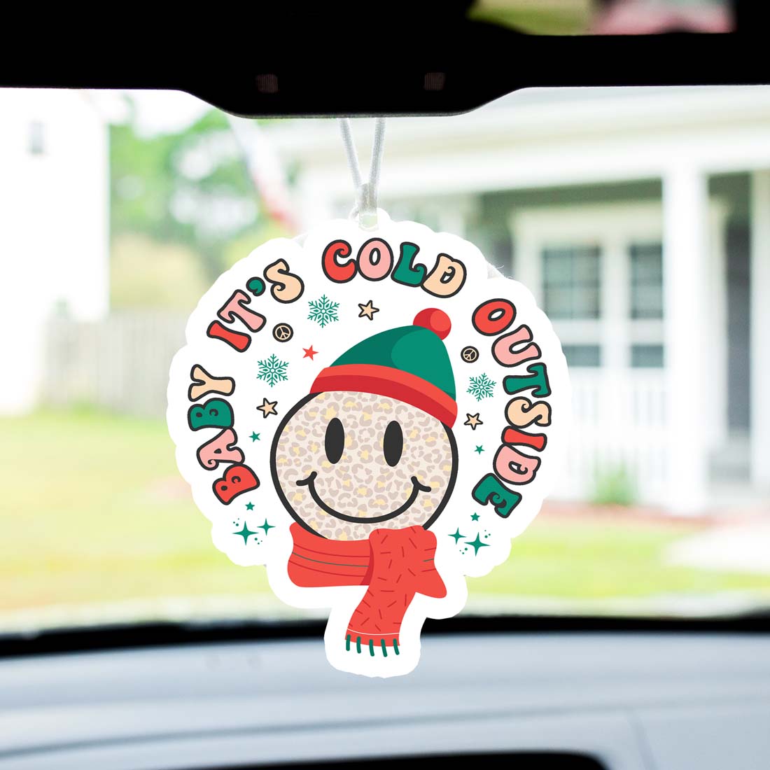 Baby It's Cold Freshie air freshener hanging with festive design, showcasing its vibrant colors and charming shape.