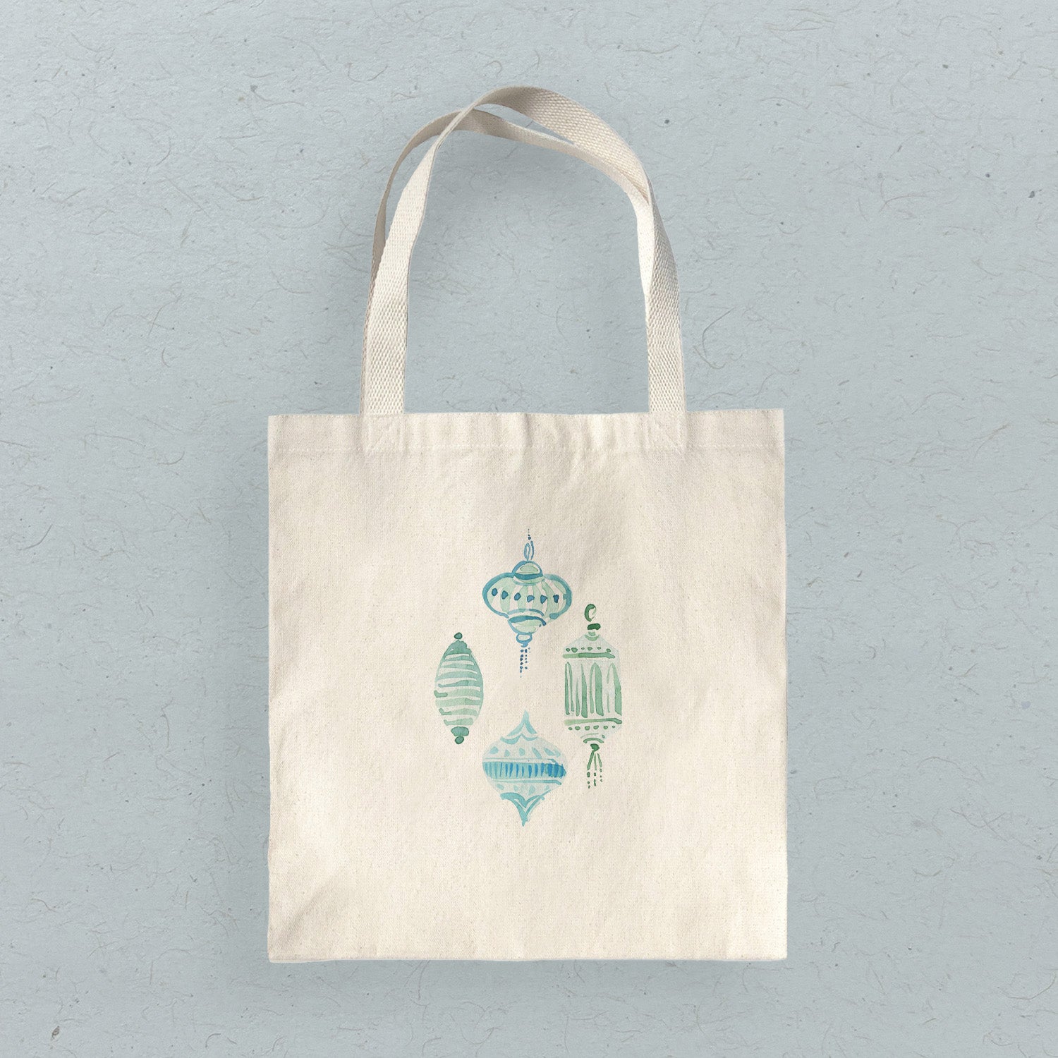 Blue Ornaments Canvas Tote Bag featuring a vibrant design, heavy-duty fabric, and reinforced straps, perfect for eco-friendly shopping.