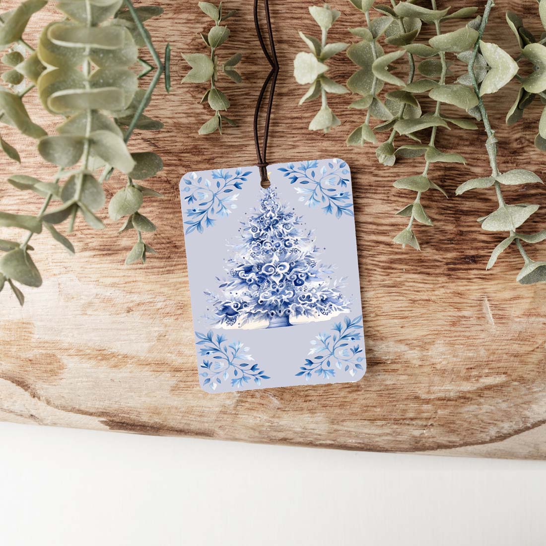 Blue Tree Freshie hanging air freshener with vibrant colors and charming design, perfect for adding fragrance to any space.