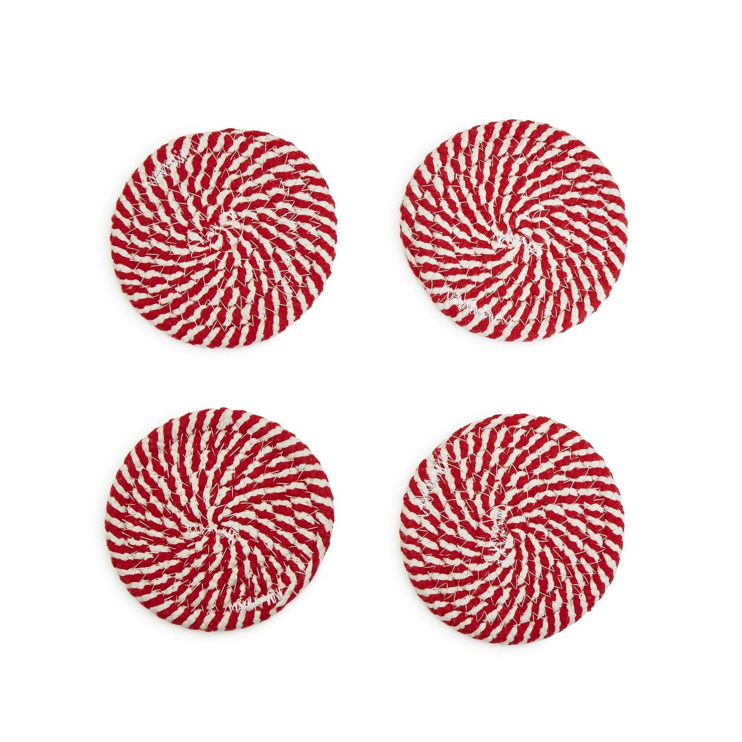 A set of four candy cane striped coasters with braided detail, perfect for holiday decor.