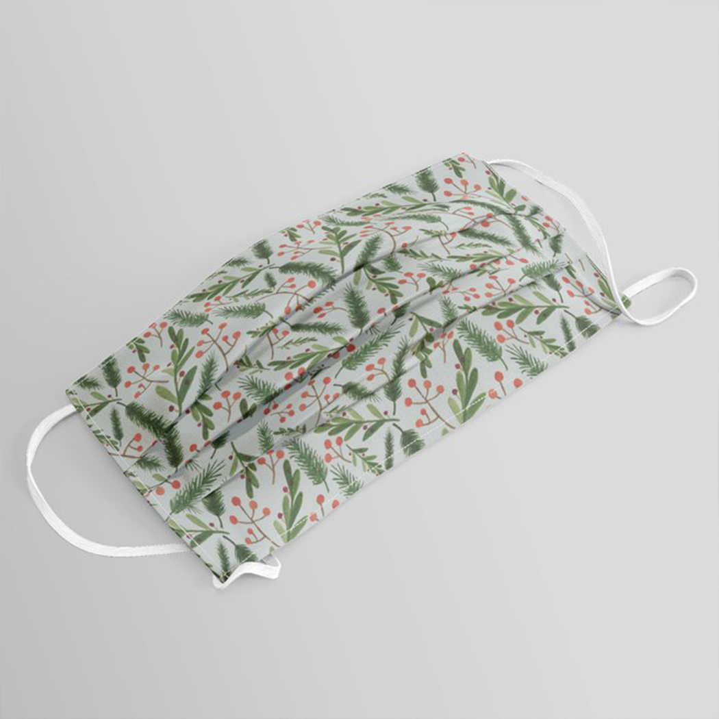 Christmas Branch Face Mask featuring festive design, pleated front, and elastic ear loops for comfort.