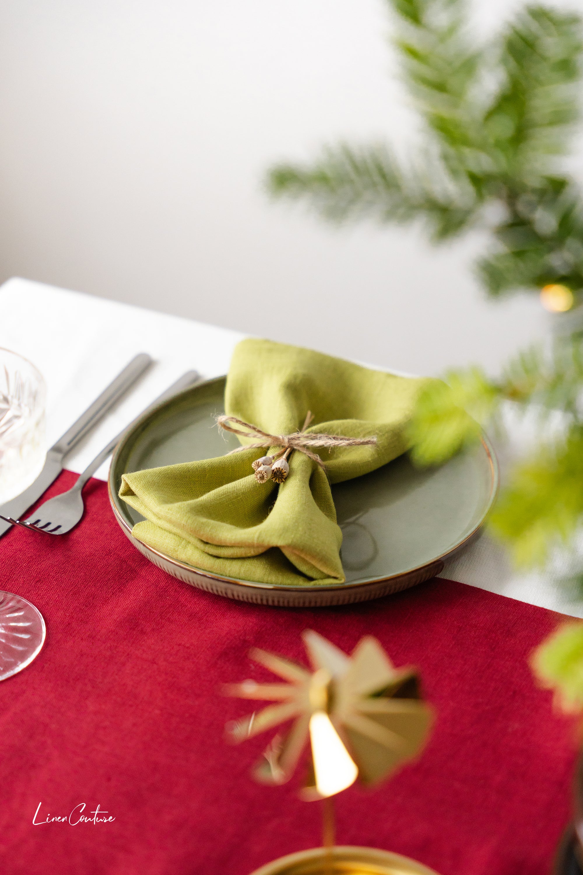 Set of two Christmas Pear Linen Dinner Napkins made from 100% stonewashed European linen, featuring a decorative hem and available in festive colors.